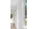Bright, minimalist hallway with white walls and natural light from large windows at 924 Trowman Ln, Mount Pleasant, SC 29464