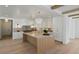 Bright kitchen with an island, modern lighting, marble countertops, and stainless appliances at 924 Trowman Ln, Mount Pleasant, SC 29464