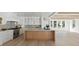 Open-concept kitchen with a large island, stainless steel appliances, and modern light fixtures at 924 Trowman Ln, Mount Pleasant, SC 29464