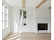 Bright living room with fireplace, wood flooring and exposed ceiling beams at 924 Trowman Ln, Mount Pleasant, SC 29464