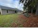 A spacious backyard with a wooden deck, offering a serene outdoor retreat and room for recreation at 9914 Levenshall Dr, Ladson, SC 29456