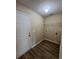 A practical laundry room with washer hookups and shelving, offering convenience and organization at 9914 Levenshall Dr, Ladson, SC 29456