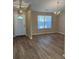 Bright living room featuring durable, modern flooring and ample natural light through front window at 9914 Levenshall Dr, Ladson, SC 29456