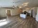 Bright and open living space connecting the kitchen and a spacious living room with a fireplace at 9914 Levenshall Dr, Ladson, SC 29456