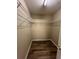 A walk-in closet featuring ample shelving and modern flooring, perfect for organized storage at 9914 Levenshall Dr, Ladson, SC 29456