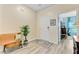 Inviting entryway with a decorative rug, bench, and plant, leading to a bright living space at 1003 Locals St, Summerville, SC 29485