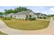 Well-manicured lawn complements this charming single-story home with a welcoming front porch in a peaceful neighborhood at 1003 Locals St, Summerville, SC 29485