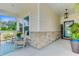 Charming front porch with rocking chairs, stone accents, and a welcoming 'WELCOME' sign by the front door at 1003 Locals St, Summerville, SC 29485