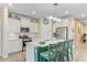 Bright kitchen with stainless steel appliances, a large island with seating, and ample counter space at 1003 Locals St, Summerville, SC 29485