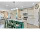 Spacious kitchen features a large island with seating, stainless steel appliances, and stylish pendant lighting at 1003 Locals St, Summerville, SC 29485