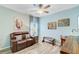 Inviting living room with light blue walls, a leather loveseat, and stylish decor at 1003 Locals St, Summerville, SC 29485