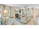 Cozy living room featuring a fireplace, comfortable seating, and ample natural light, perfect for relaxation at 1003 Locals St, Summerville, SC 29485