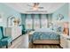 Main bedroom features decorative wall art, furniture, and bright natural light from windows at 1003 Locals St, Summerville, SC 29485
