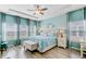 Spacious main bedroom featuring tray ceiling, ceiling fan, and natural light from window at 1003 Locals St, Summerville, SC 29485