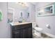 Updated bathroom features modern vanity with granite countertops, and a white toilet at 1016 Providence Way, Summerville, SC 29483