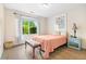 Bright bedroom with wood floors, a bed, a window, and a side table at 1016 Providence Way, Summerville, SC 29483