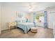 Bedroom with wood floors, a bed, side table and window at 1016 Providence Way, Summerville, SC 29483