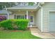 Close up of the well-maintained home entrance with neatly trimmed bushes at 1016 Providence Way, Summerville, SC 29483