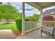 Charming front porch with a chair and lush landscaping at 1016 Providence Way, Summerville, SC 29483