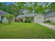 Charming single-story home with lush green lawn and manicured landscaping at 1016 Providence Way, Summerville, SC 29483