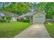 Well-maintained home featuring a neatly manicured lawn and a paved driveway at 1016 Providence Way, Summerville, SC 29483