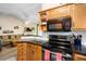 Bright kitchen featuring stainless steel appliances, granite countertops and a view of the living room at 1016 Providence Way, Summerville, SC 29483
