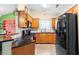 Charming kitchen with black granite countertops, stainless steel appliances and tile backsplash at 1016 Providence Way, Summerville, SC 29483