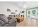 Inviting living room with vaulted ceiling, fireplace, French doors and cozy seating at 1016 Providence Way, Summerville, SC 29483