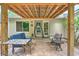 Covered patio with outdoor seating, perfect for relaxing and entertaining at 1016 Providence Way, Summerville, SC 29483