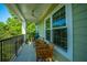 A serene balcony with chairs offers a tranquil space with a ceiling fan overhead at 1025 Riverland Woods Pl # 1023, Charleston, SC 29412