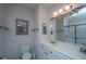 Bathroom with stylish vanity, framed art and mirrors, with a glass-enclosed shower at 1025 Riverland Woods Pl # 1023, Charleston, SC 29412