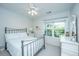 Bright bedroom with large windows offering lots of natural light at 1025 Riverland Woods Pl # 1023, Charleston, SC 29412