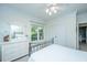 Comfortable bedroom with soft natural light, clean white walls, and matching dressers at 1025 Riverland Woods Pl # 1023, Charleston, SC 29412