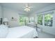 Comfortable bedroom with a metal bed frame, bright windows, and a neutral color palette at 1025 Riverland Woods Pl # 1023, Charleston, SC 29412
