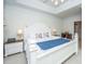 Spacious bedroom with trey ceiling, lamps on nightstands, and connecting door at 1025 Riverland Woods Pl # 1023, Charleston, SC 29412
