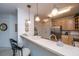 Inviting kitchen featuring a breakfast bar with seating and stainless steel appliances at 1025 Riverland Woods Pl # 1023, Charleston, SC 29412