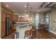 Stylish kitchenette with stainless steel appliances, granite countertops, and a breakfast bar with seating for casual dining at 1025 Riverland Woods Pl # 1023, Charleston, SC 29412