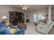 Cozy living room with fireplace, plush seating, and a large entertainment center at 1025 Riverland Woods Pl # 1023, Charleston, SC 29412