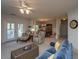 Open-concept living room with fireplace and comfortable seating at 1025 Riverland Woods Pl # 1023, Charleston, SC 29412