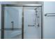 Modern shower features glass doors and walls, chrome fixtures and built in seating at 1025 Riverland Woods Pl # 1023, Charleston, SC 29412