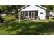 Outdoor dining on the screened porch and relaxing outdoor space at 104 Waccamaw Dr, Summerville, SC 29485