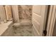 Beautiful bathroom featuring marble floors and walls, with gold fixtures and a white vanity at 104 Waccamaw Dr, Summerville, SC 29485