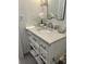 Elegant bathroom vanity with white marble countertop, chrome fixtures, and ample storage drawers at 104 Waccamaw Dr, Summerville, SC 29485