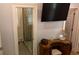 Bathroom showcasing a glass-enclosed shower and vanity with decorative mirror, vanity and television at 104 Waccamaw Dr, Summerville, SC 29485