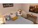 Charming bedroom with a white bed, decorative pillows, and a decorative table with candle at 104 Waccamaw Dr, Summerville, SC 29485