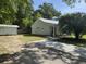 Home exterior featuring a driveway and nicely landscaped front yard at 104 Waccamaw Dr, Summerville, SC 29485
