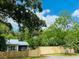 Charming home featuring new privacy fence nestled beneath the shade of mature trees at 104 Waccamaw Dr, Summerville, SC 29485