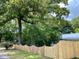 Charming home featuring a newly installed picket fence for added security and curb appeal at 104 Waccamaw Dr, Summerville, SC 29485