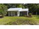 Well-maintained front yard with lush green grass and mature trees at 104 Waccamaw Dr, Summerville, SC 29485