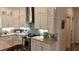 The modern kitchen showcases white cabinets, granite countertops, stainless steel appliances, and a tiled backsplash at 104 Waccamaw Dr, Summerville, SC 29485